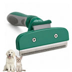Green pet deshedding tool with a stainless steel comb blade and anti-slip handle alongside a puppy and kitten.