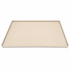 Beige rectangular pet silicone dining mat featuring a raised border and textured paw print pattern across the surface.
