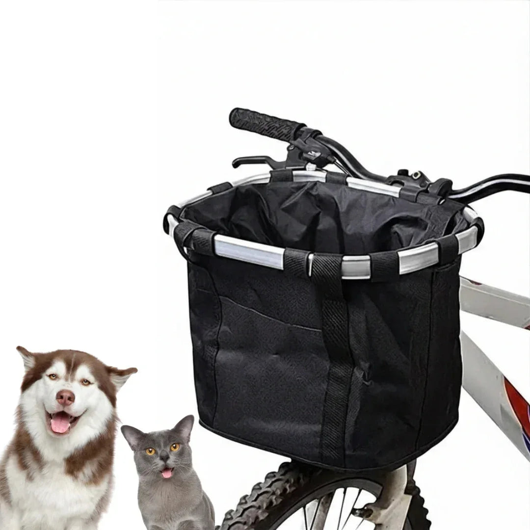 Studio photo of a husky dog and grey cat posing next to the mounted black Petifo bike basket.