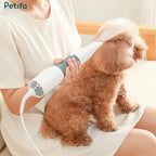 Groomer using the Petifo pet grooming dryer on a brown poodle for drying and brushing.