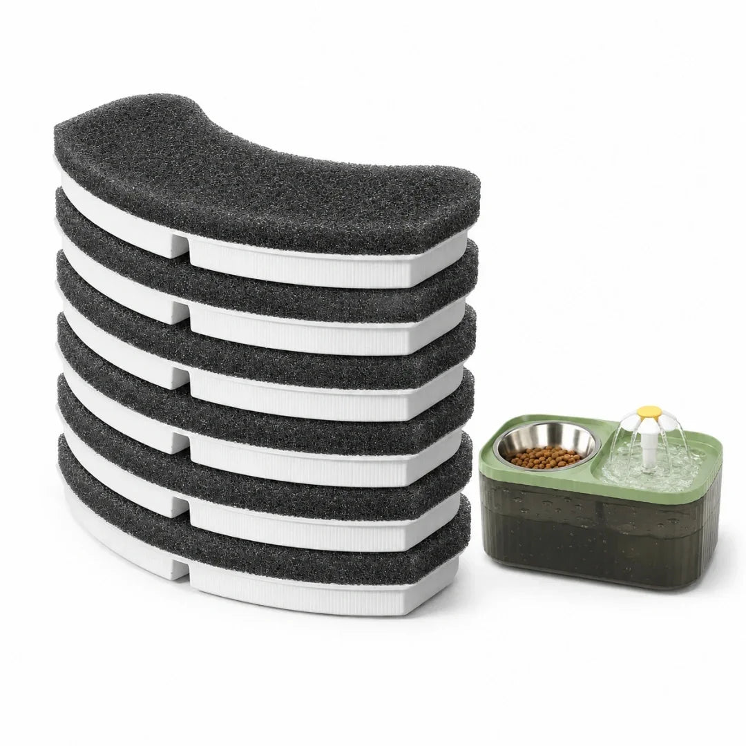 A stack of replacement carbon filters next to a green automatic cat water fountain and feeder.