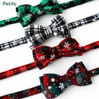 Close-up view of four different colored plaid Christmas cat collars with bow ties.