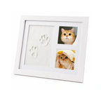 White wooden pet memory keepsake frame featuring clay paw prints and dual photo slots displaying a cute cat.