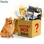 Gold mystery box packed with essential pet care gear next to a pomeranian.