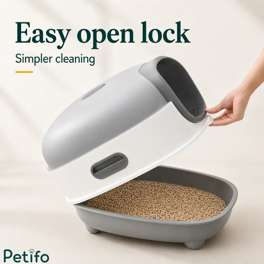 Person demonstrating the easy open lock mechanism of the grey and white hooded cat litter box for simpler daily cleaning.