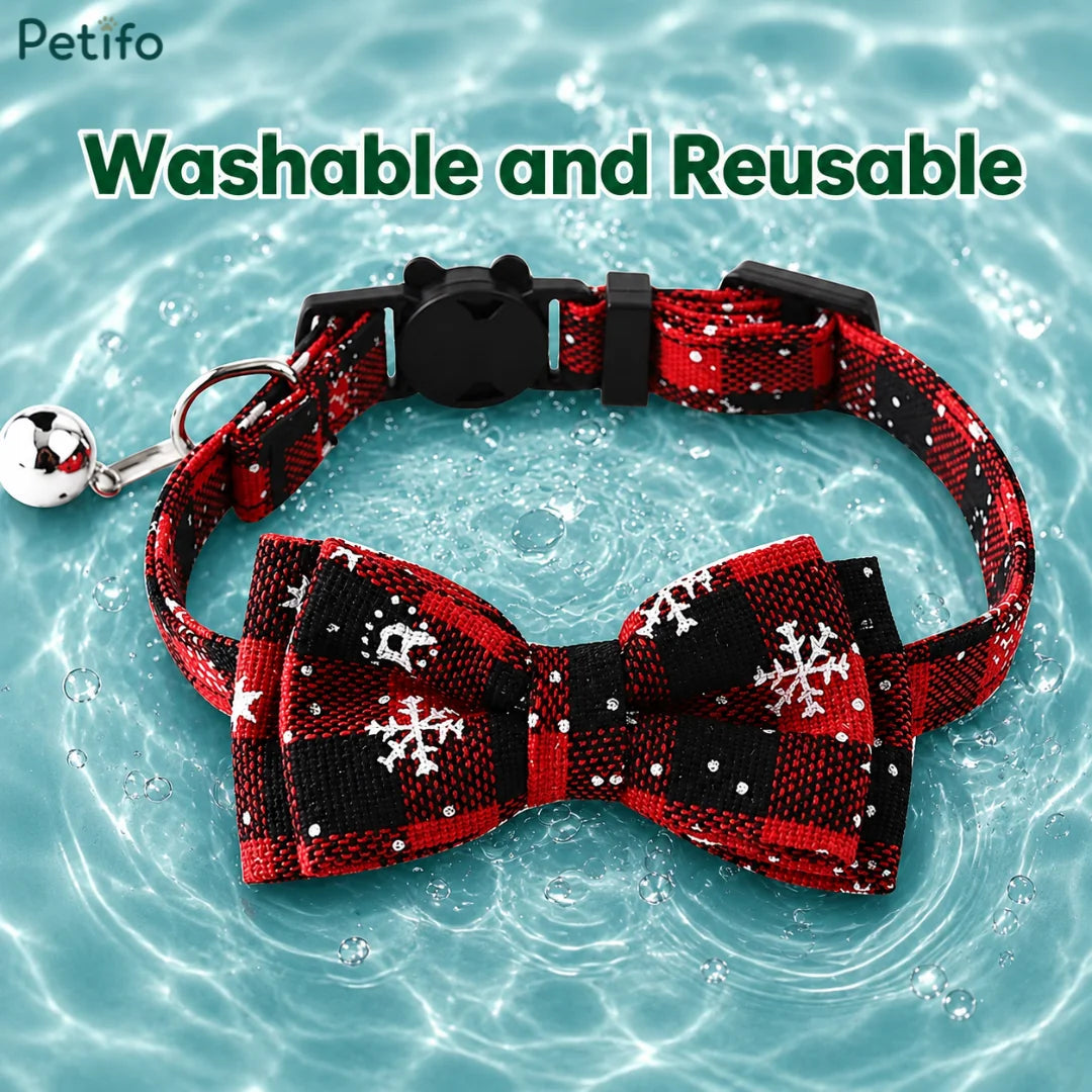 Red and black plaid Christmas cat collar placed on water to highlight its washable and reusable material.