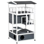 Multi-tier outdoor wooden cat house and climbing tower featuring grey and white panels.