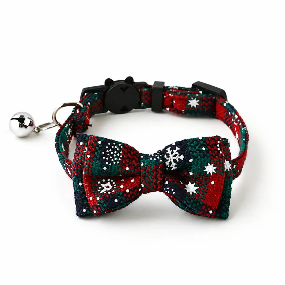 Festive red and green plaid Christmas cat collar with snowflake prints.