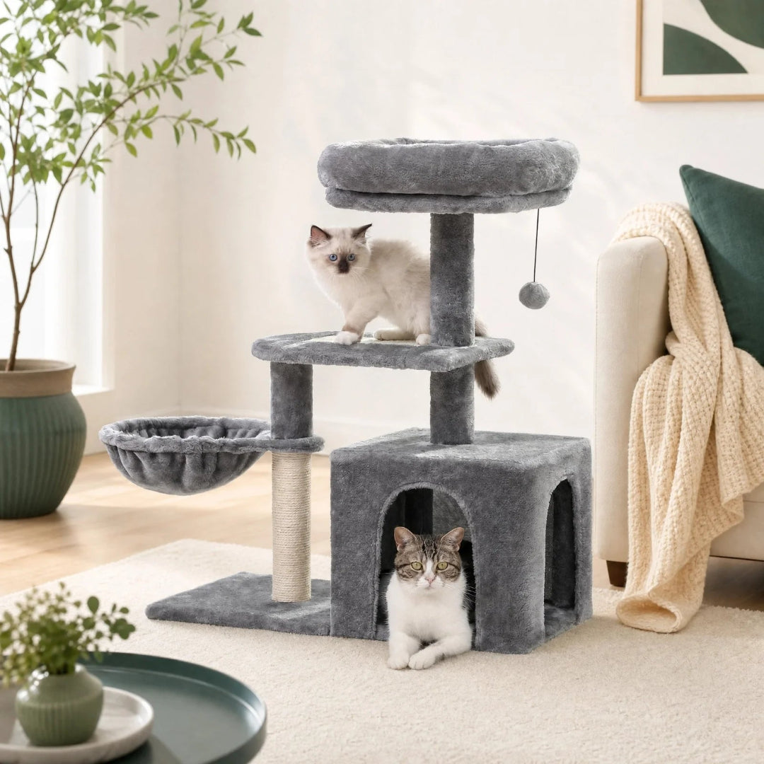 Two cats enjoying a cozy grey cat tower that includes a hanging basket, multi-level platforms, and an enclosed resting condo.
