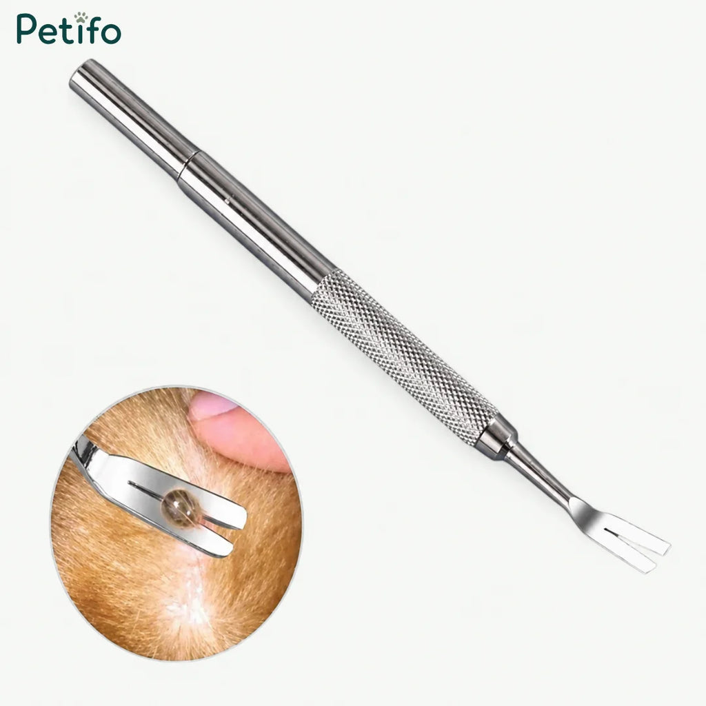 Professional stainless steel tick removal fork tool shown removing a tick from animal fur.