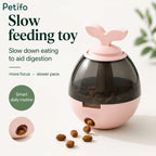 Pink Petifo sprout slow feeder toy dispensing kibble treats on smooth surface
